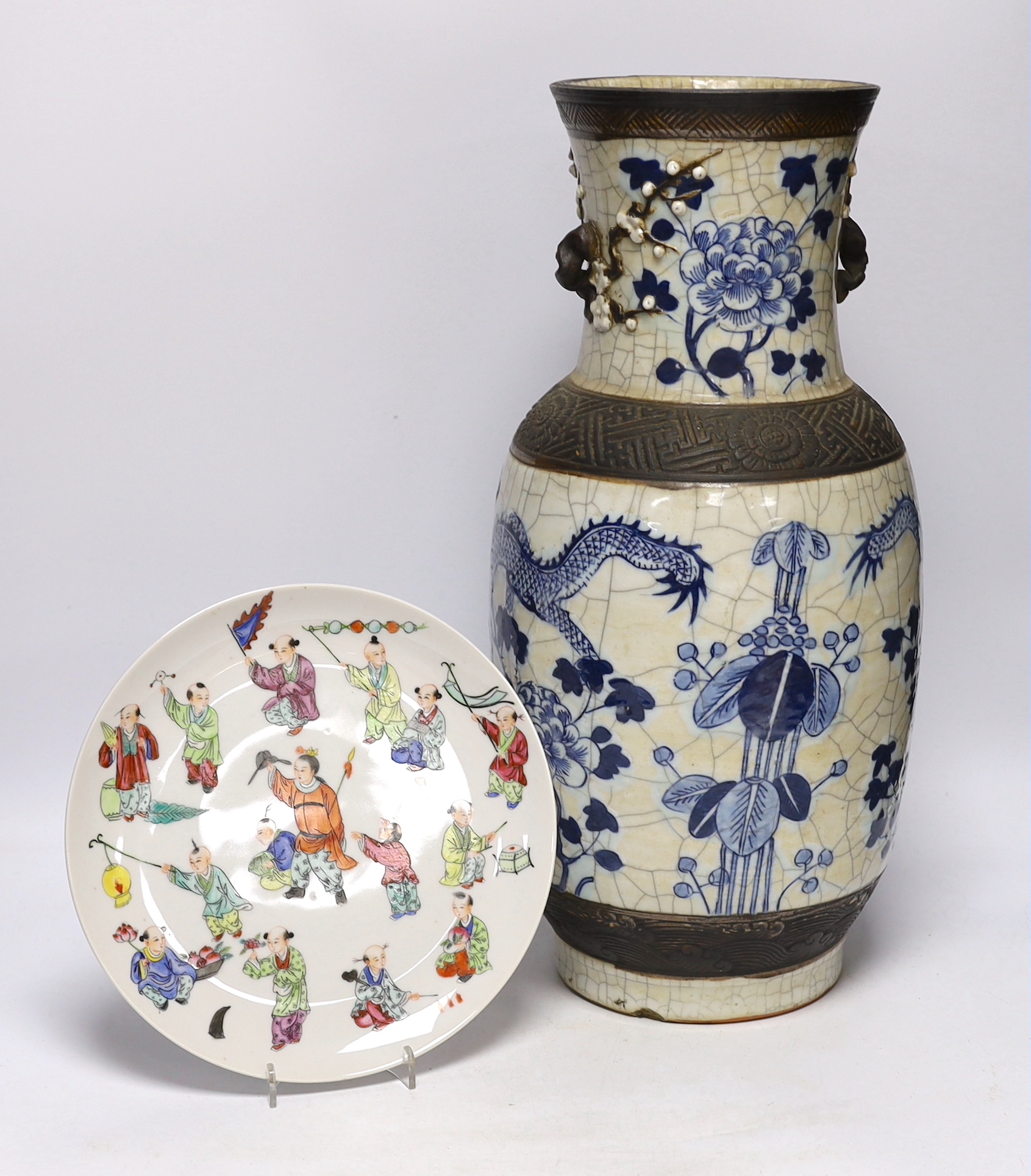 A large early 20th century Chinese blue and white crackle vase and a later plate decorated with children, 46cm high